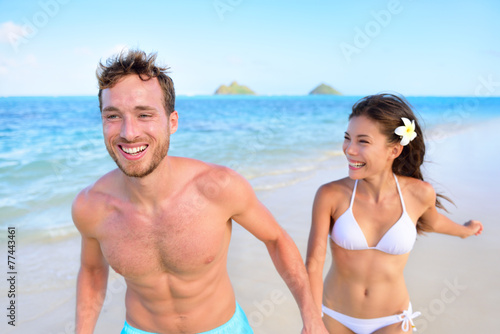 Happy couple having fun on beach vacation