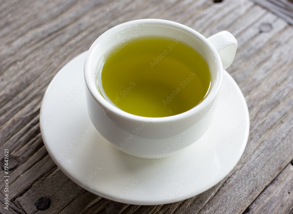 Hot green tea on wood table. Hot green tea on wood table.
