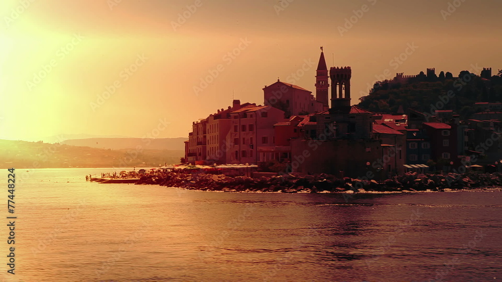Shot of the shore near Piran during the sunset, taken from the moving boat Shot of the shore near Piran during the sunset, taken from the moving boat