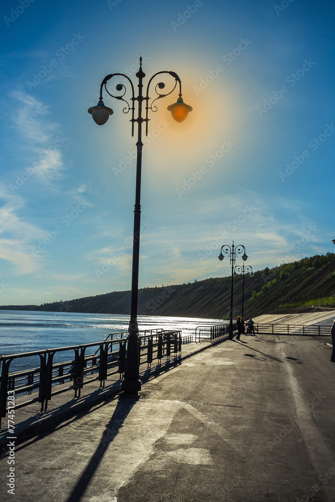 Street lights on the promenade of great river