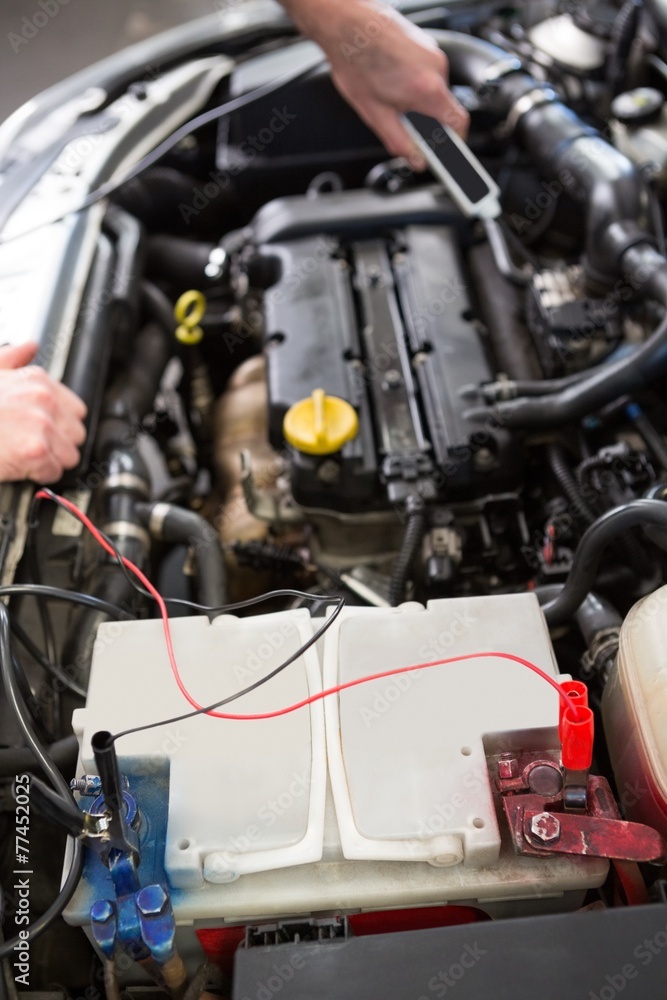 Mechanic working under the hood
