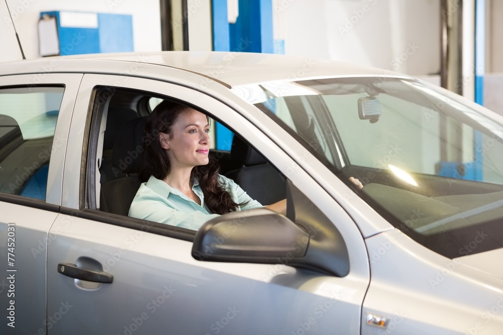 Smiling woman in her car Smiling woman in her car