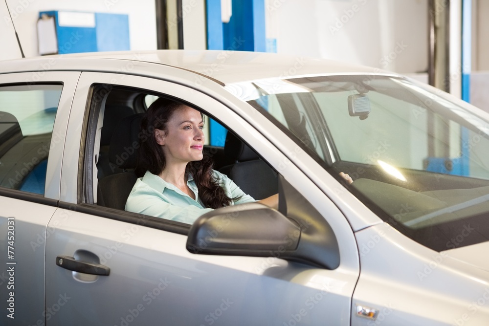 Smiling woman in her car