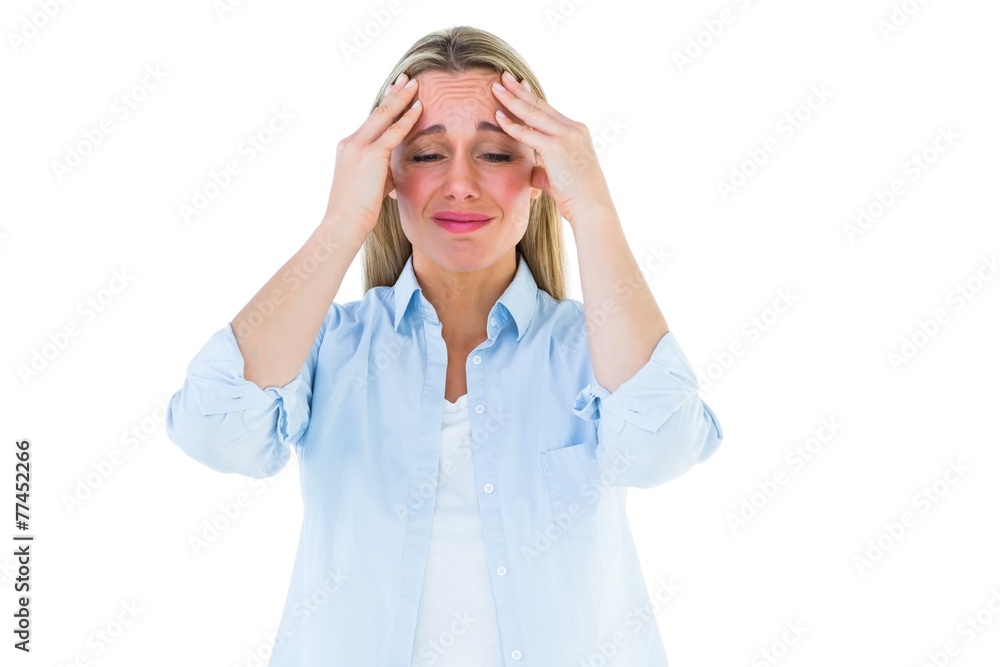 Portrait of a blonde getting a headache Portrait of a blonde getting a headache