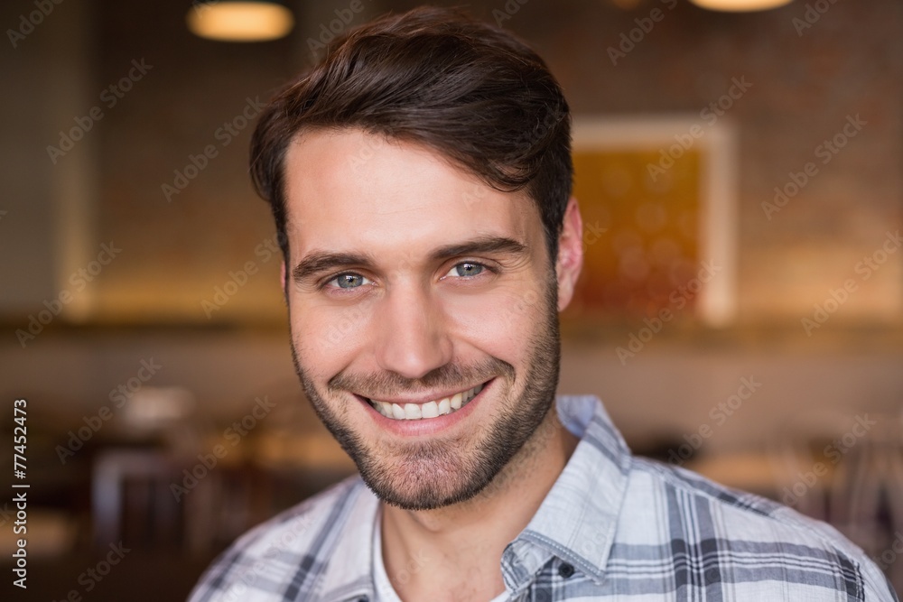 Young man smiling at camera Young man smiling at camera