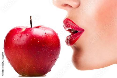 sexy woman eating red apple, sensual red lips