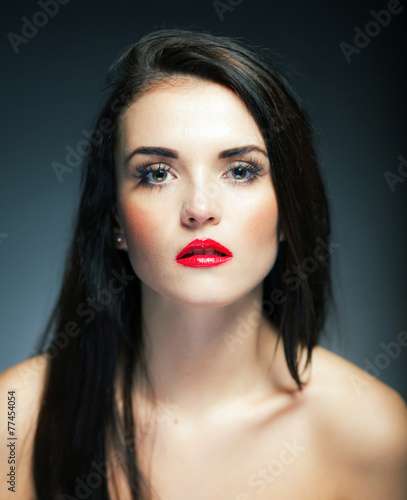 Natural woman face with red lips and long hair