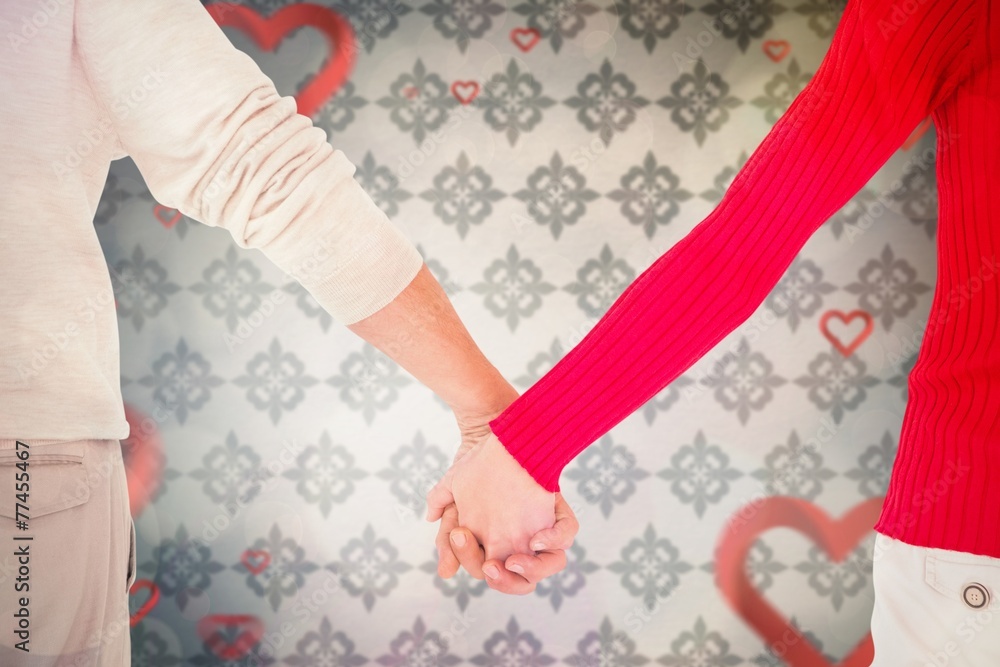 Composite image of couple holding hands rear view