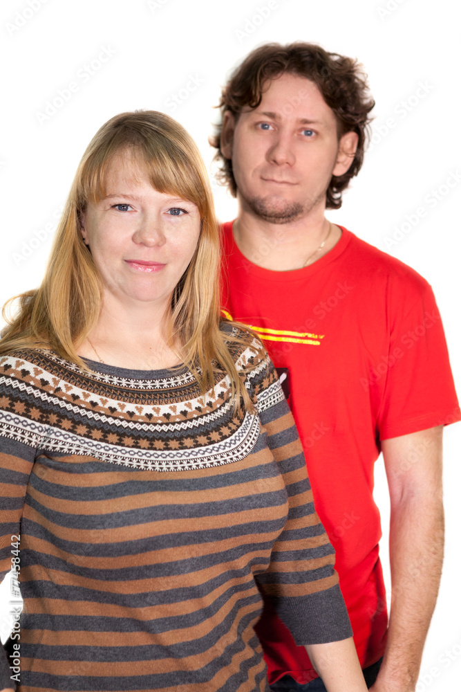 A young Caucasian couple on a white background A young Caucasian couple on a white background