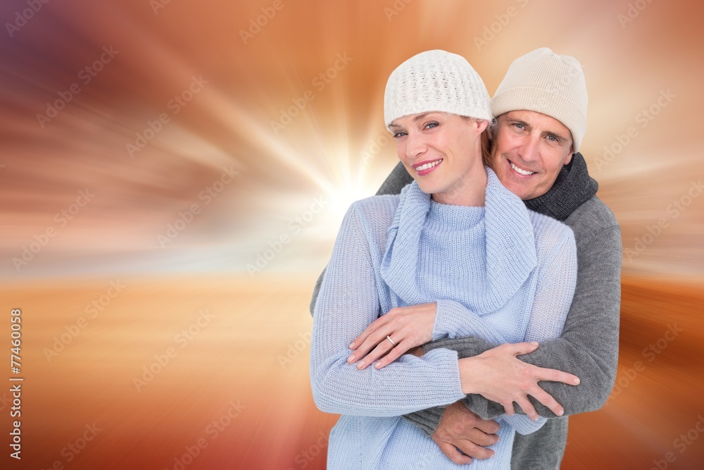 Composite image of casual couple in warm clothing Composite image of casual couple in warm clothing