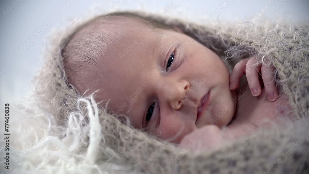 Baby's face all covered up in warm cover Baby's face all covered up in warm cover