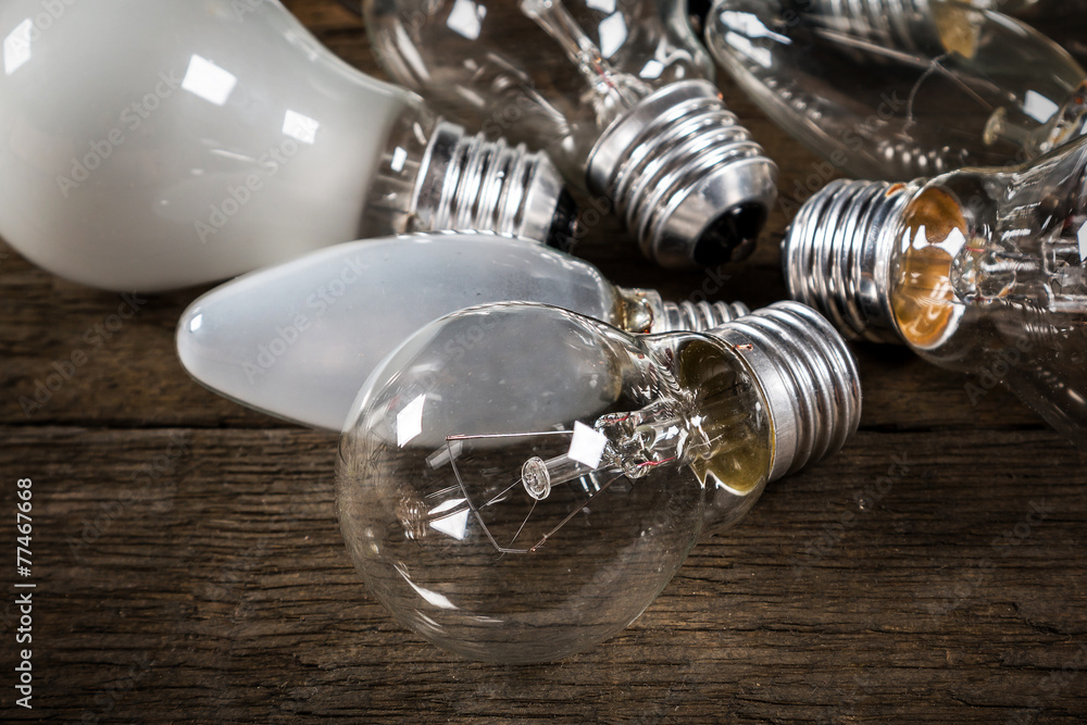 Lightbulbs on wooden background Lightbulbs on wooden background