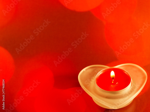 Obraz na płótnie Red candle with fire on red background w salonie