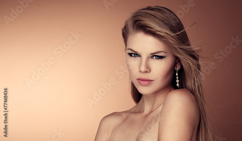 Close-up of gorgeous woman with healthy long straight hair