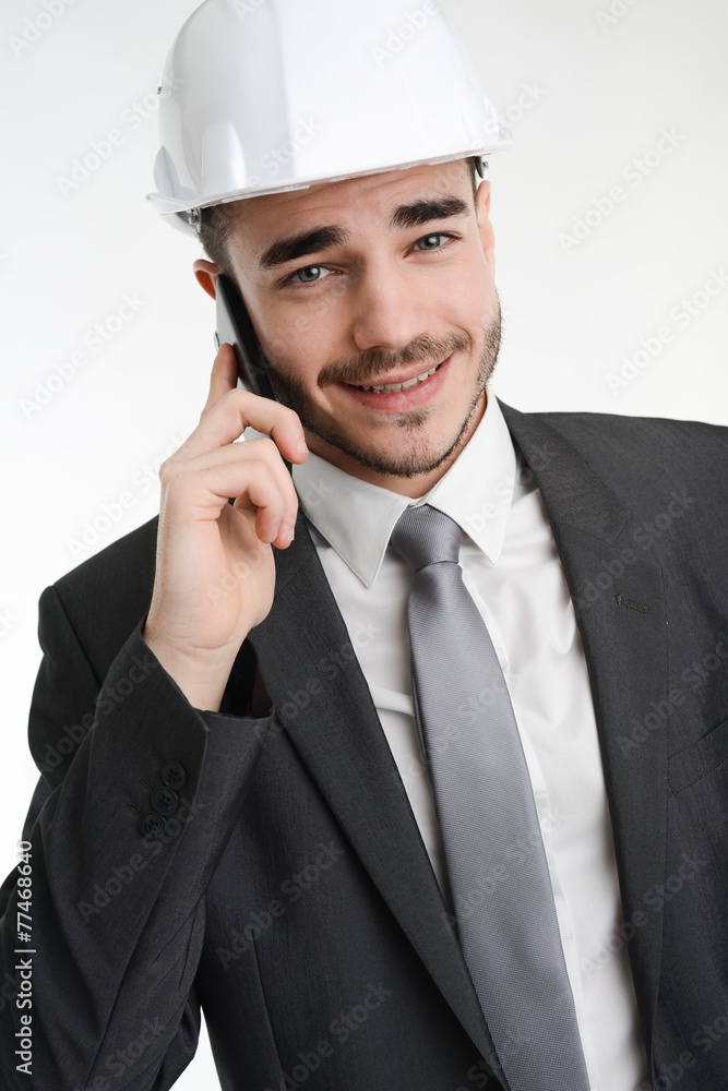 young manager foreman with safety helmet making phone call young manager foreman with safety helmet making phone call