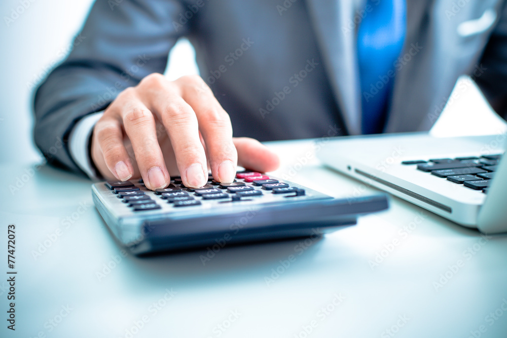 Closeup of businessman hands typing on laptop computer Closeup of businessman hands typing on laptop computer