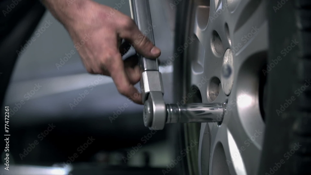 Loosening the screw on a tire Loosening the screw on a tire