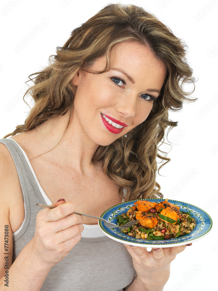 Young Woman Eating Chicken Tikka and Rice Salad Young Woman Eating Chicken Tikka and Rice Salad