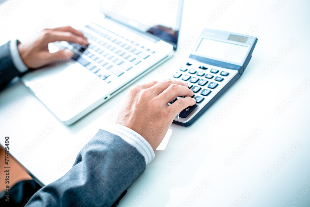 Closeup of businessman hands typing on laptop computer Closeup of businessman hands typing on laptop computer