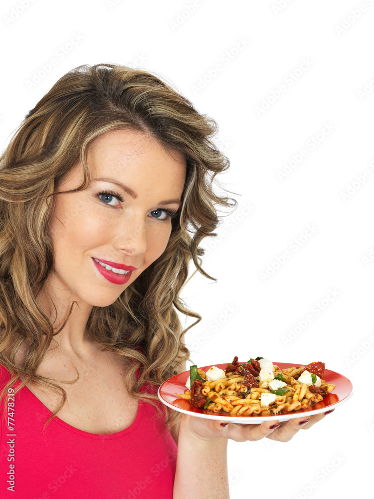 Young Woman Eating a Feta Cheese and Tommato Pasta Salad Young Woman Eating a Feta Cheese and Tommato Pasta Salad