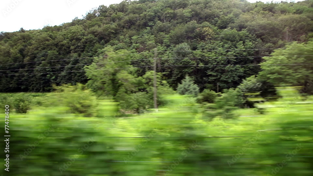 Shot of the landscape from the moving train Shot of the landscape from the moving train
