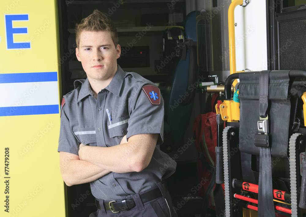 Paramedic employee with ambulance in the background. Paramedic employee with ambulance in the background.