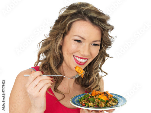 Young Woman Eating a Chicken Tikka and Rice Salad