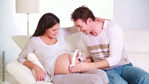 young father sharing music with his baby