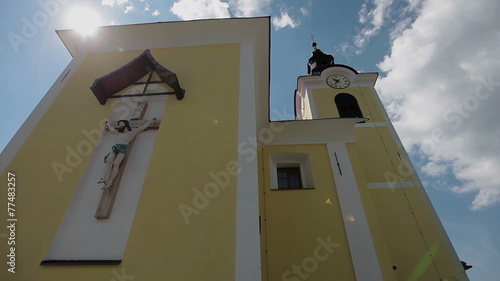 Close tilt shot of a church on a bright sunny day in Lukovica, Slovenia photo