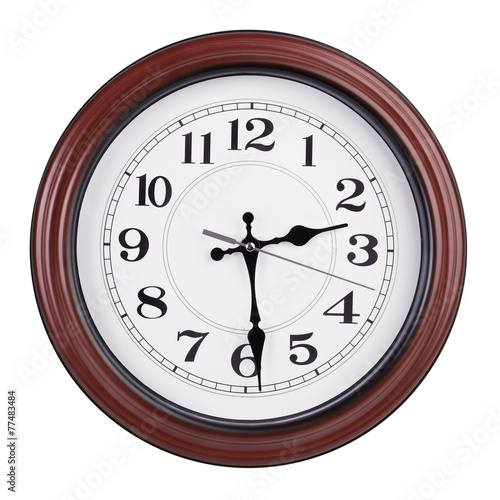 Round clock shows half of the third