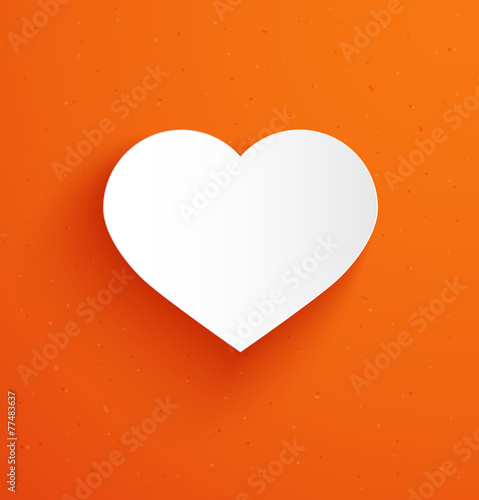 White paper heart on orange background