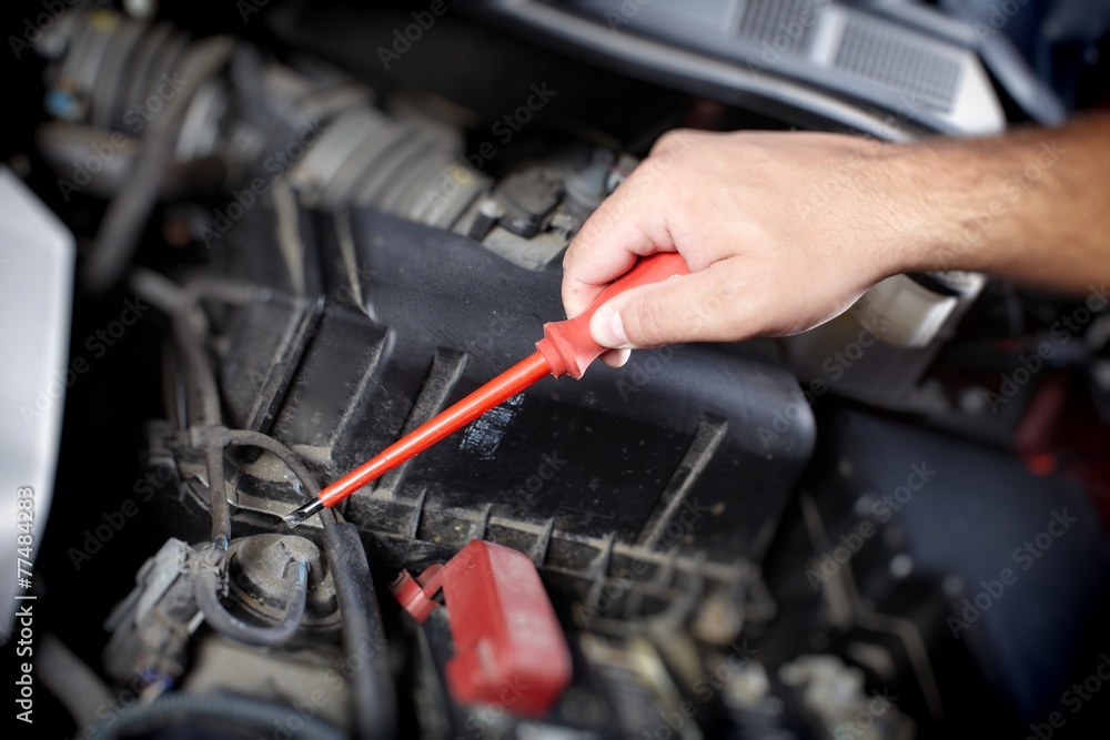 Mechanic working in auto repair garage Mechanic working in auto repair garage