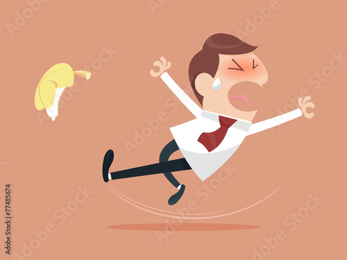 Businessman slipping and falling from a banana peel