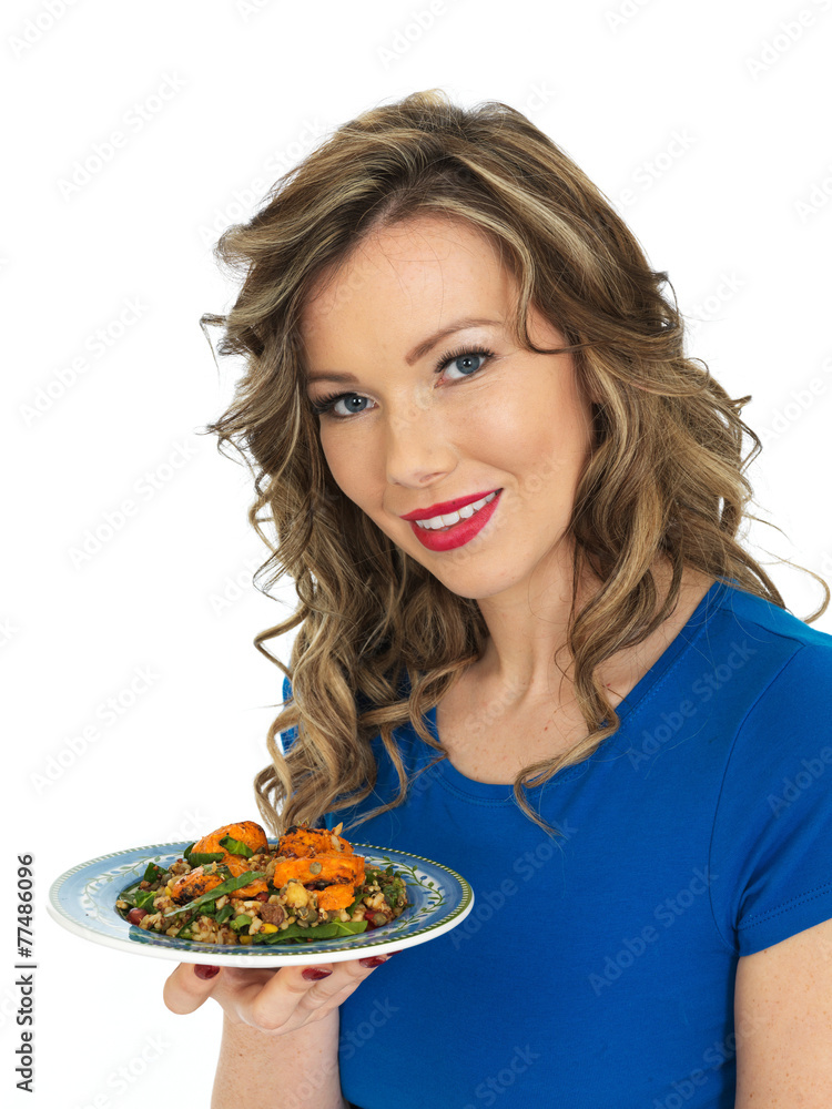 Young Woman Eating Chicken Tikka and Rice Salad