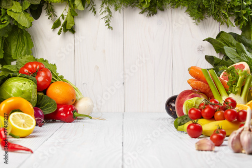 Fototapeta Naklejka Na Ścianę i Meble -  Fruit and vegetable borders on white wooden old table