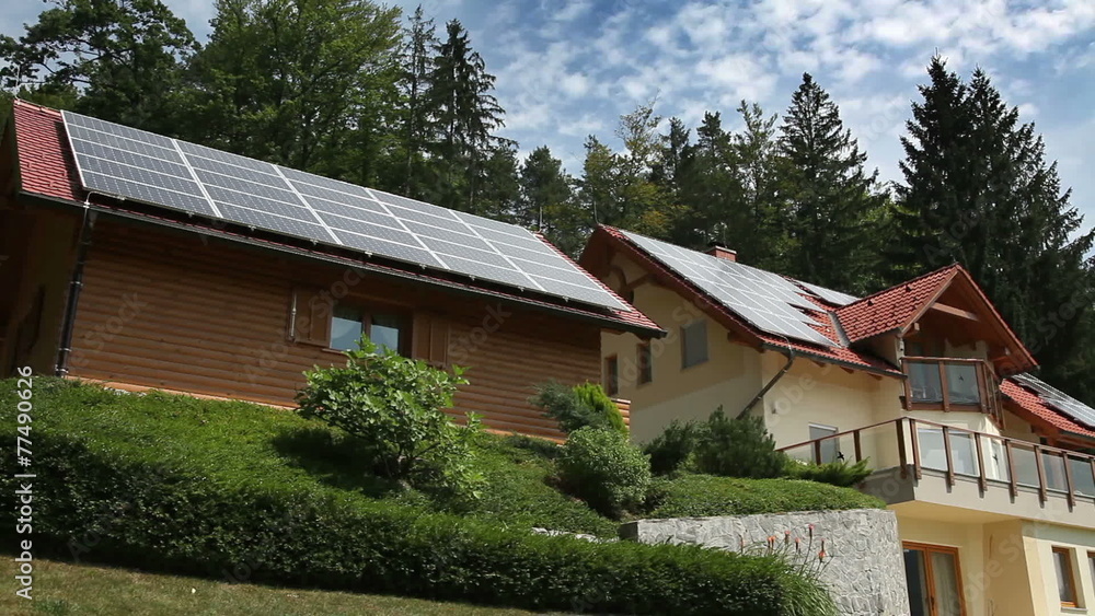 Beutiful house with solar panels on the roof Beutiful house with solar panels on the roof