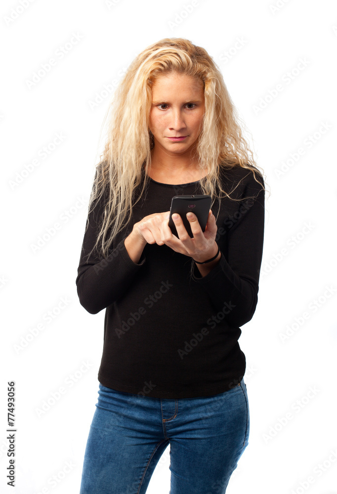 Fototapeta premium Worried girl using a mobile