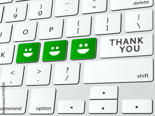 Thank you written over computer keyboard with happy faces