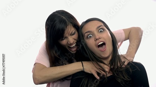 One women trying to strangle another on white background photo