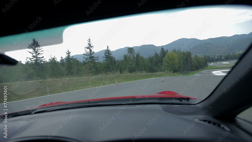Driving on the racing track from a co-drivers seat Driving on the racing track from a co-drivers seat