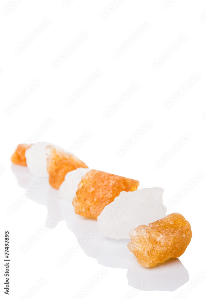 White rock sugar and sugar cane rock over white background White rock sugar and sugar cane rock over white background