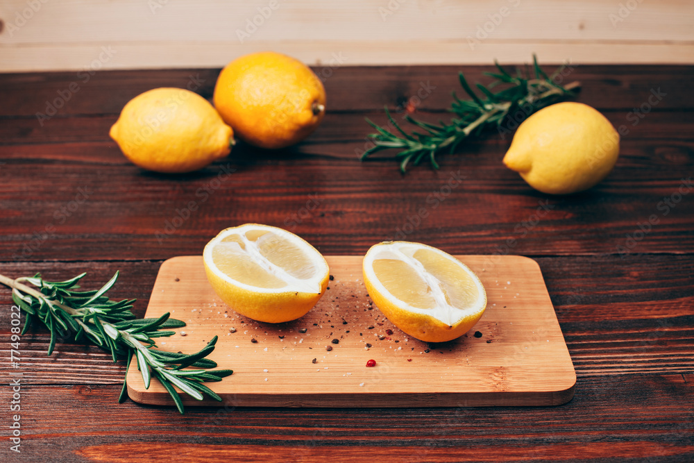 lemon halves on wooden table lemon halves on wooden table