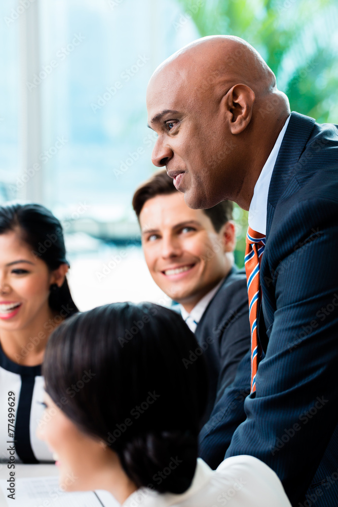 Indian Business man leading team meeting Indian Business man leading team meeting
