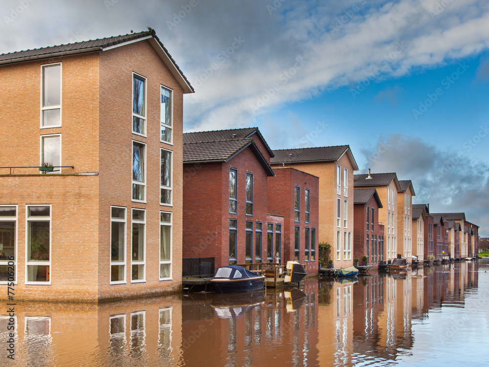 Modern Middle Class Houses along a Canal Modern Middle Class Houses along a Canal