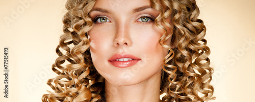 Принти на полотні Young woman with gorgeous beautiful curly hair. Blond Hair.