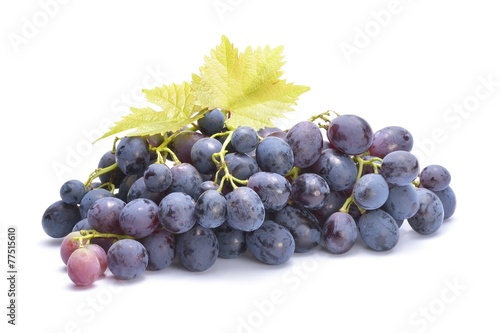 Red grape with green leaf, isolated on white