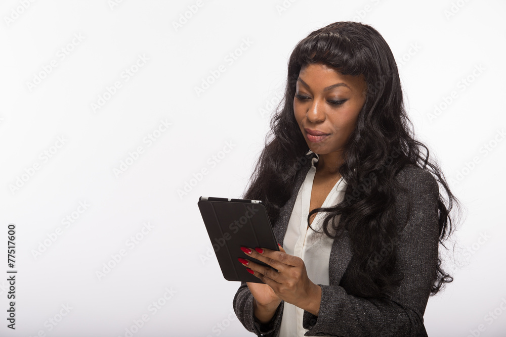 African American black woman using tablet pc computer African American black woman using tablet pc computer