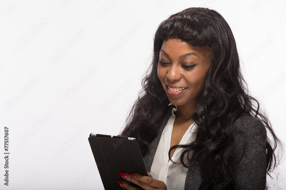 African American black woman using tablet pc computer African American black woman using tablet pc computer