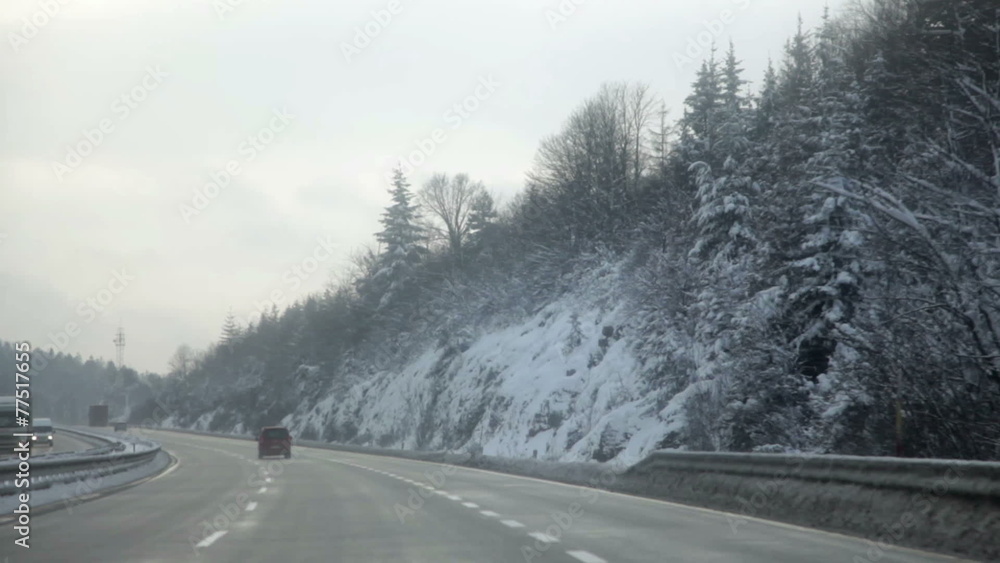 a road and driving on a highway in winter time in winter time a road and driving on a highway in winter time in winter time
