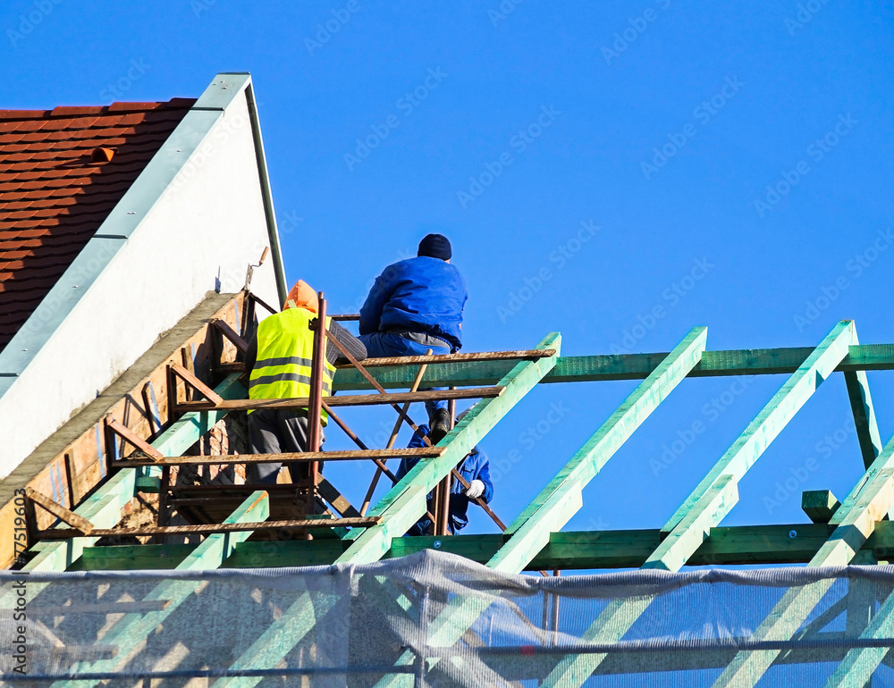 Carpenters and roofers are working